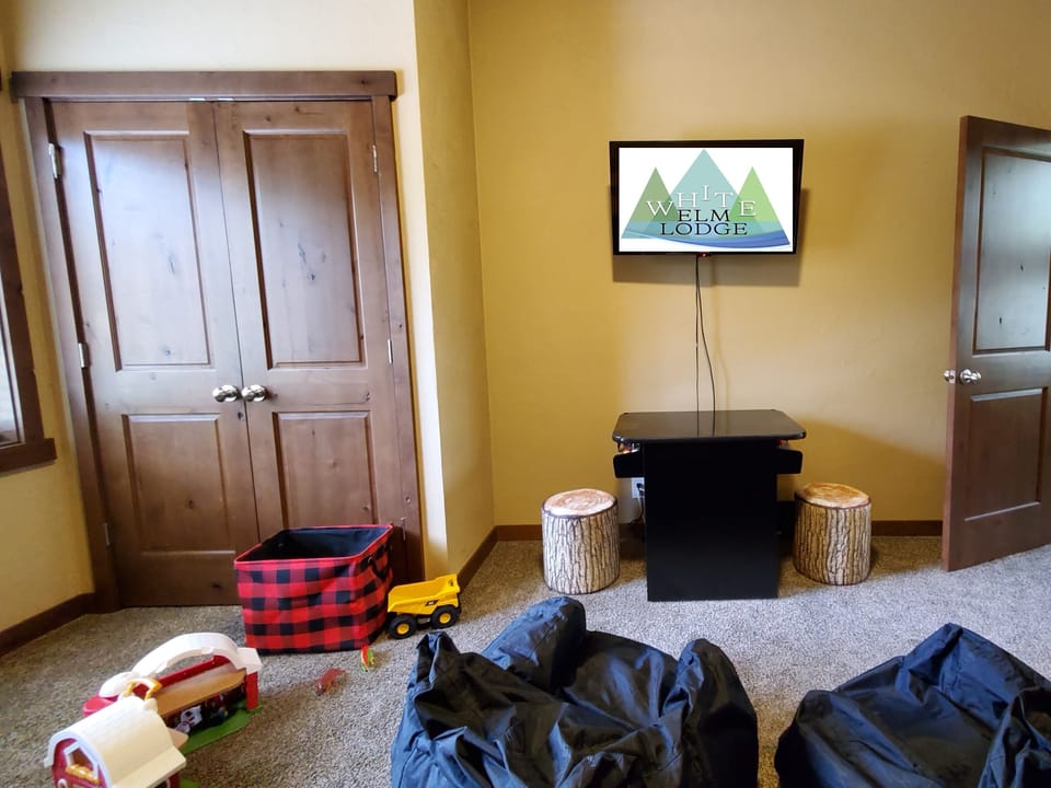 Upstairs "Bear Den" Bunk Room. Bean bag chairs, toys for young, TV/DVD, Arcade.