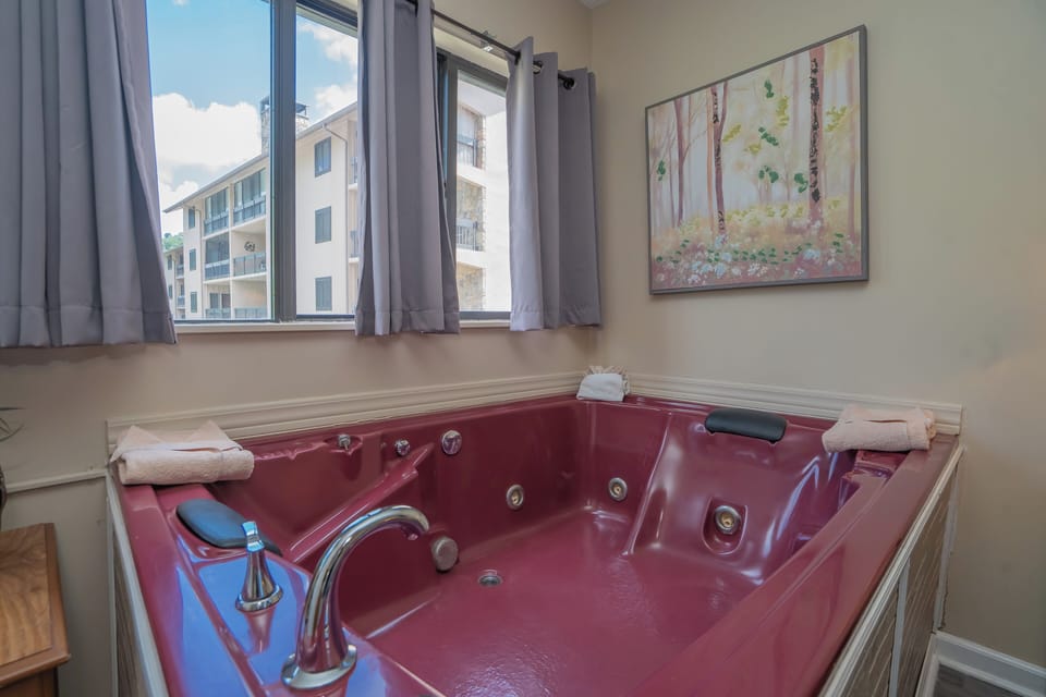 Slip into your private jetted tub and let the warm, bubbling water melt away the day. With soft towels at hand and natural light streaming in, this is your personal sanctuary for relaxation.
