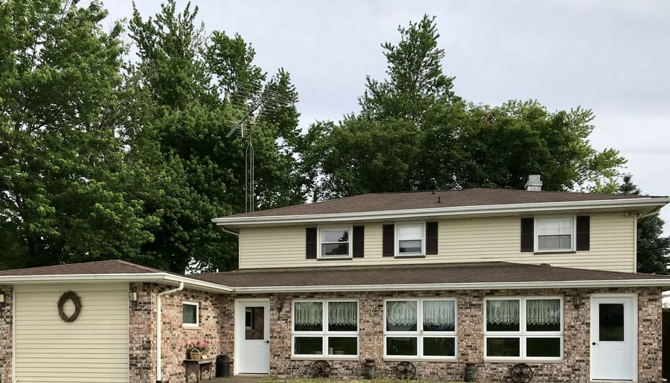 Driveway view of downstairs entrances.
