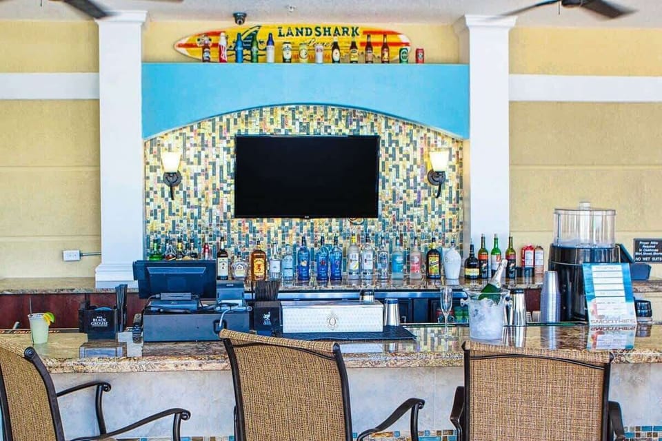 Hang out or catch some of the game at the poolside bar!