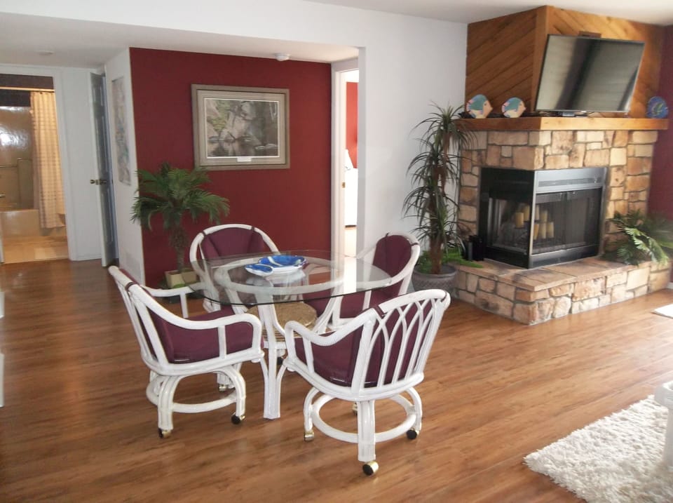 Flat screen TV above the decorative fireplace