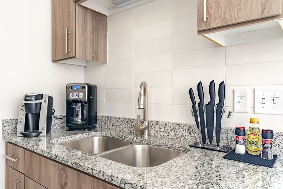 Craft tasty dishes in this contemporary kitchen with all the necessary amenities.