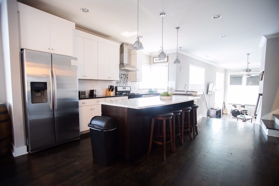 Additional seating for 4 at the large marble-top island