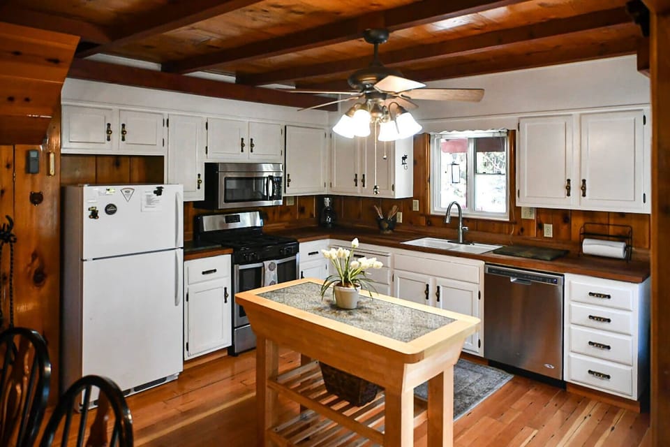 Full kitchen stocked with dishes, pots and pans, coffee maker, toaster, and more!