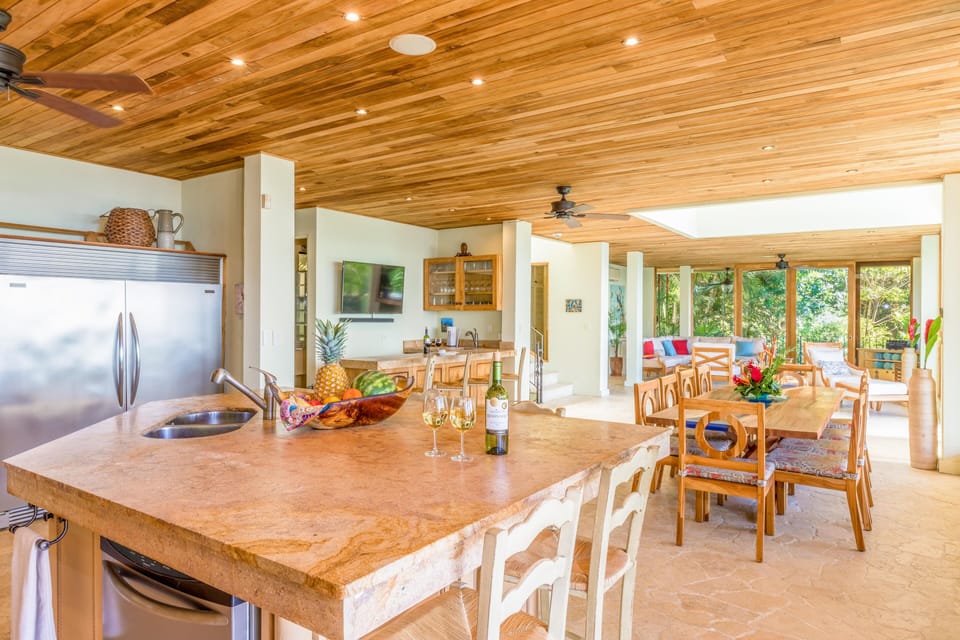 Main floor: Living room; formal dining, gourmet kitchen, bar, two decks, pool