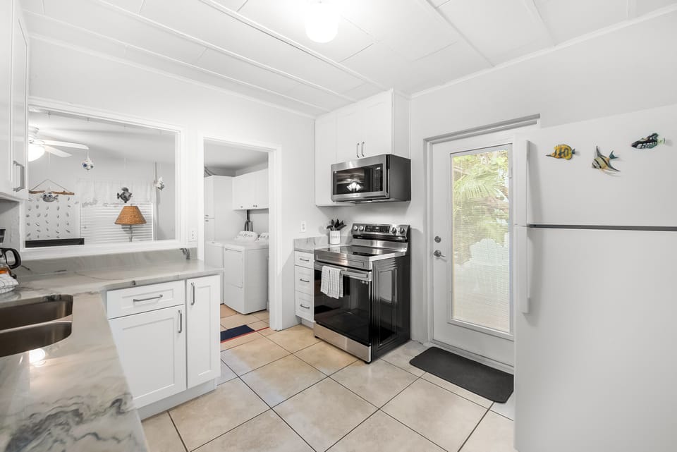 Kitchen showing fridge and range