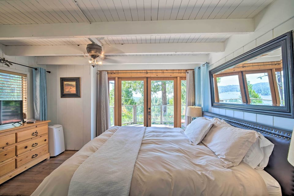 Bedroom 1 | California King Bed | 1st Floor | Deck Access | Flat-Screen TV