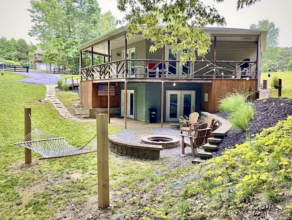 The fire pit and ambient string lights set the relaxed mood.