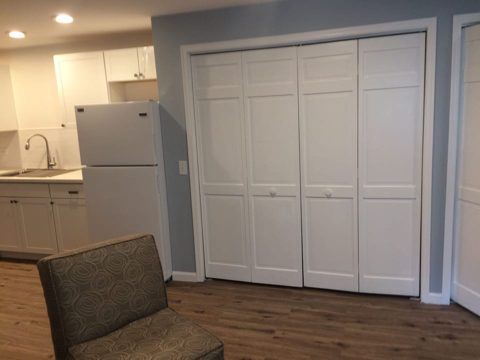 Biifold doors to kitchen cabinet storage