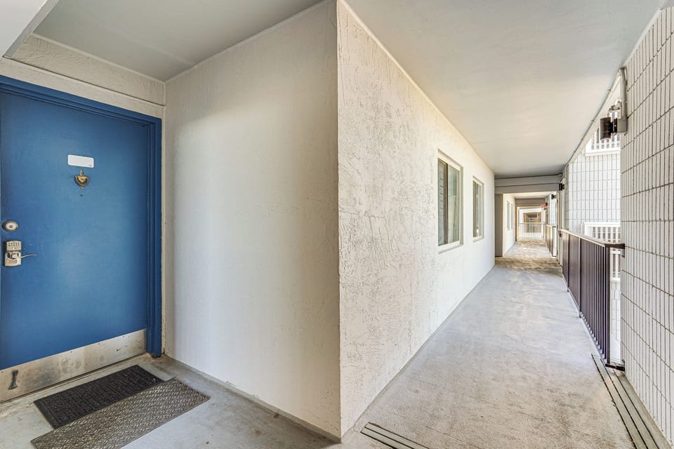 Unit Exterior | Parking | Community Lot (1 Vehicle w/ Provided Pass)