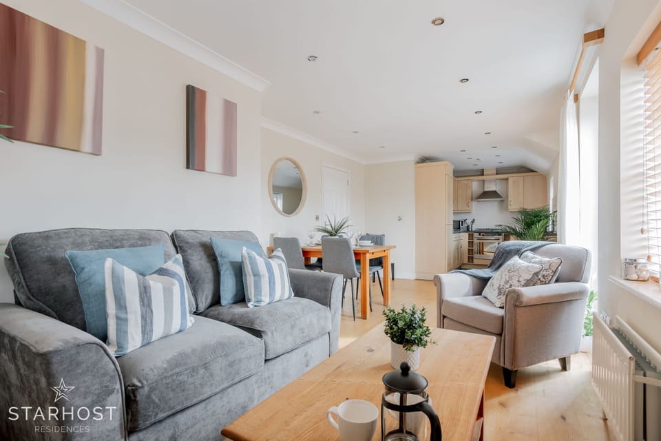 The living room is spacious and includes lounge and dining area