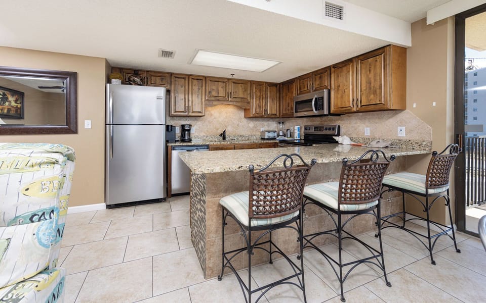 Pull up a stool at the breakfast bar and chat while meals come together in the bright kitchen area