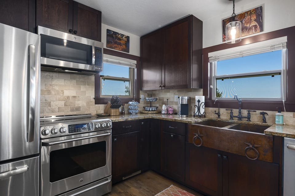 Kitchen with stainless appliances.  Breakfast is provided (Items left in frig).