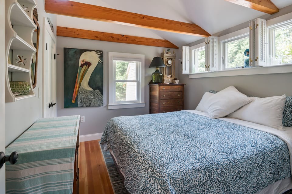 beamed queen bed bedroom