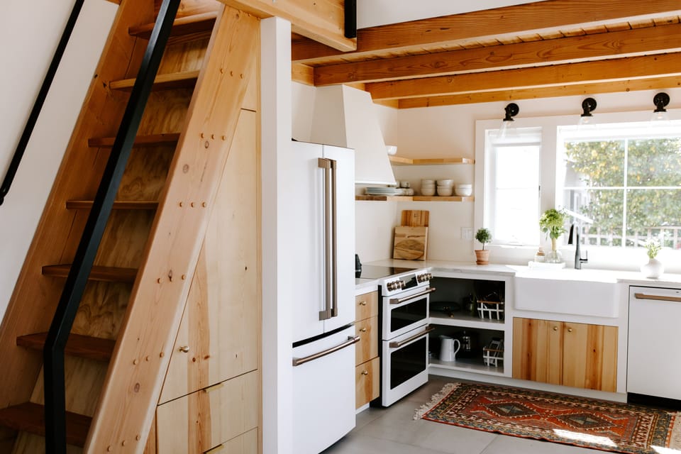Ship's ladder to loft, coffee /microwave station, and full kitchen.