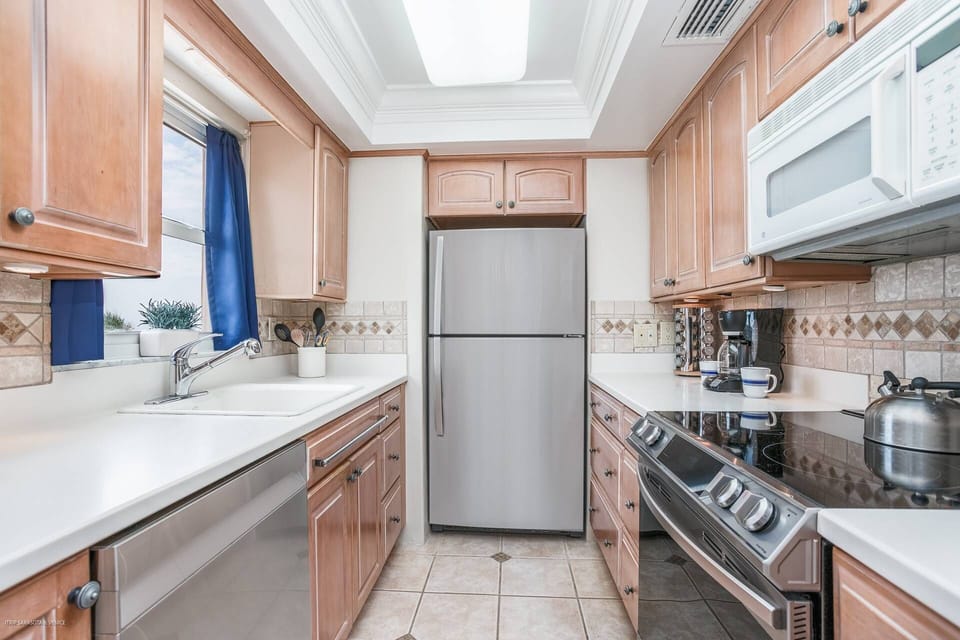 Updated kitchen stocked with all you need to cook meals at home.  Newer stainless stove and dishwasher!!