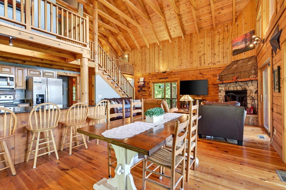 Kitchen, dining, and living areas.