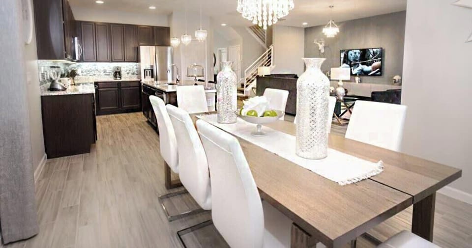 A beautiful dining area with a table to comfortably seat 8 for a formal meal.