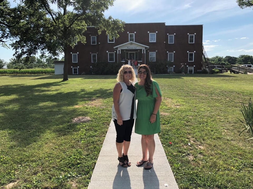 Owners in front of finished project