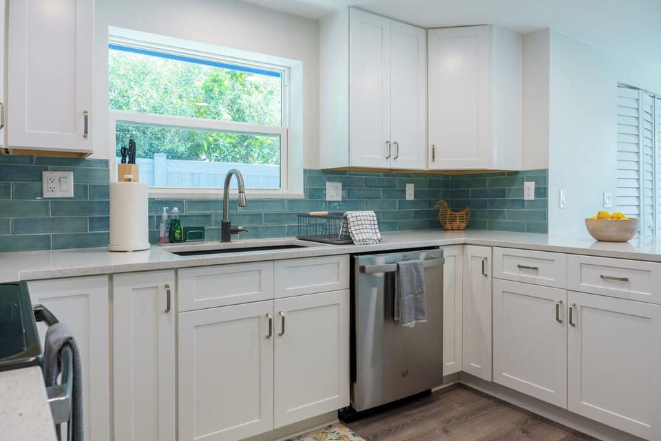 Chef's kitchen with breakfast bar and dining nook