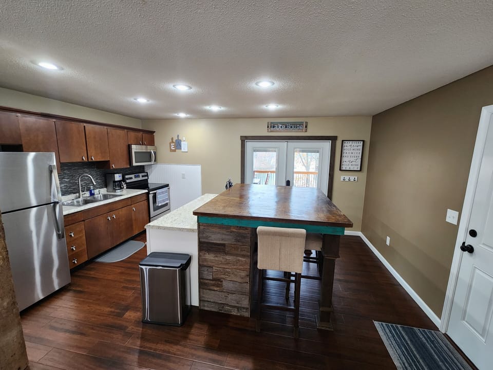 Kitchen area with walk out to covered deck