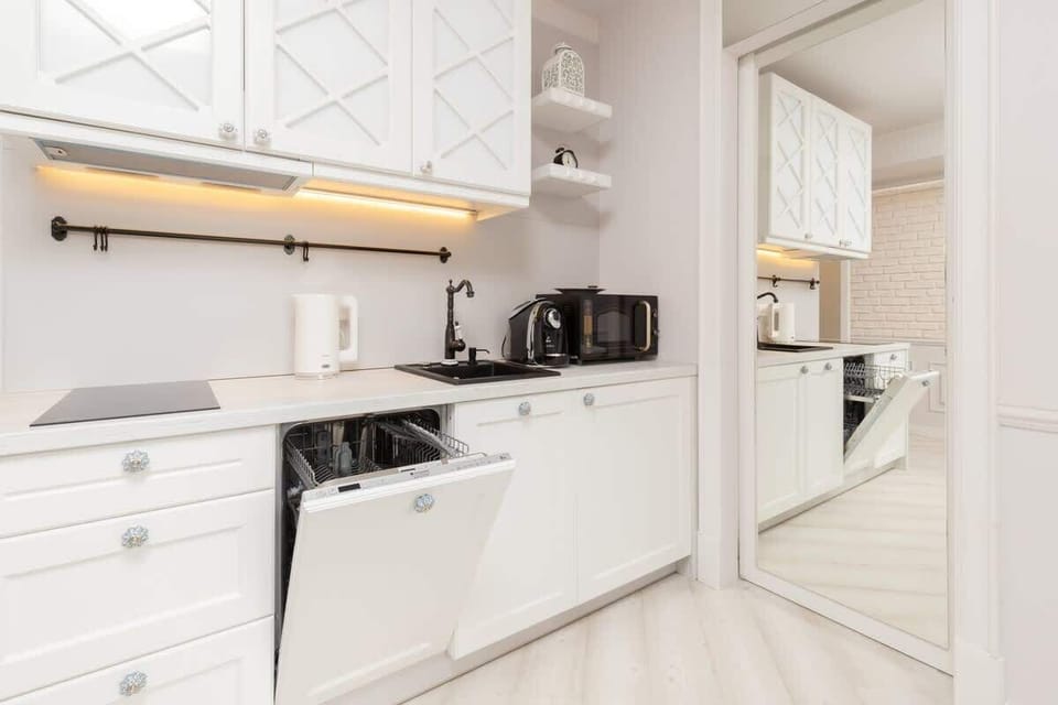 Another angle of the kitchen, showcasing its compact yet efficient design with clean lines and ample storage space.