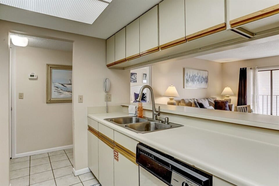 Kitchen has Pass Through to Living and Dining Area
