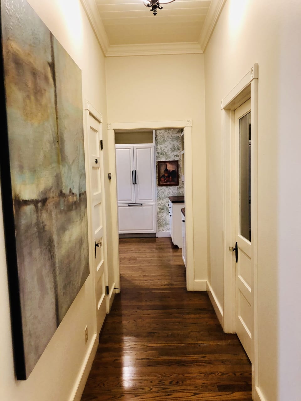 Hallway leading to Kitchen, Main Dining Room, and Sunroom.