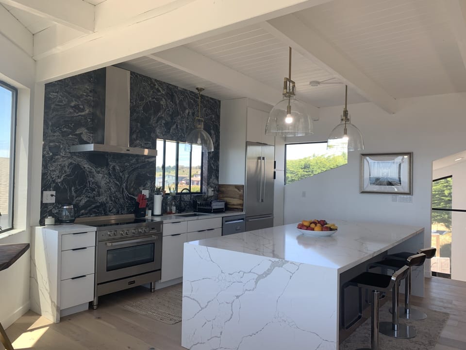 Chef kitchen with a huge eat in kitchen island 
