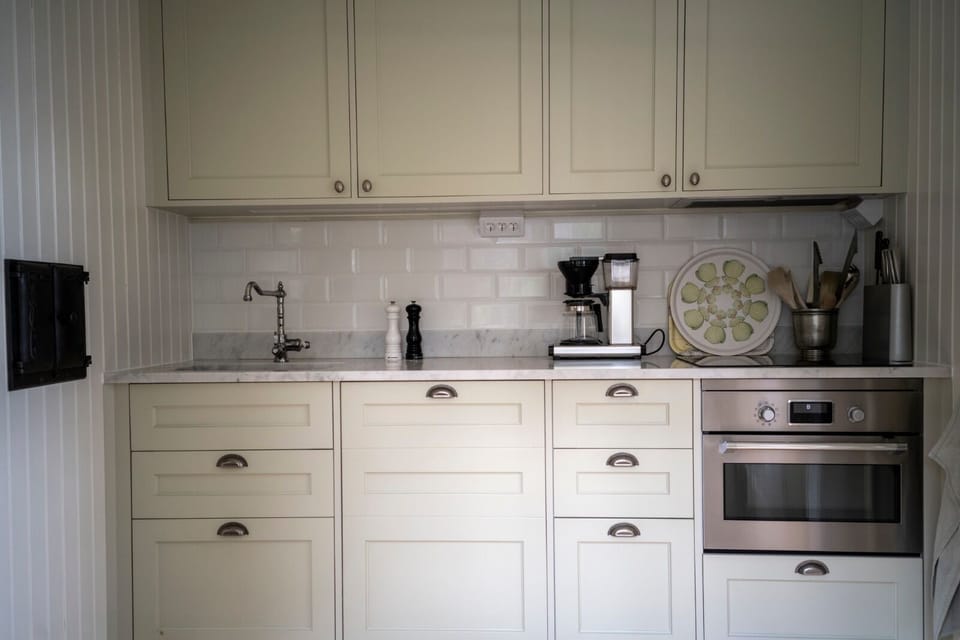 Kitchen with dishwasher, owen, microwave, brewer, toaster.