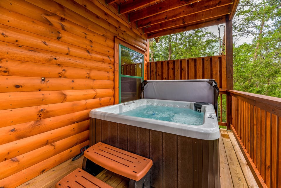 Lower deck with hot tub for 5 & peaceful wooded views