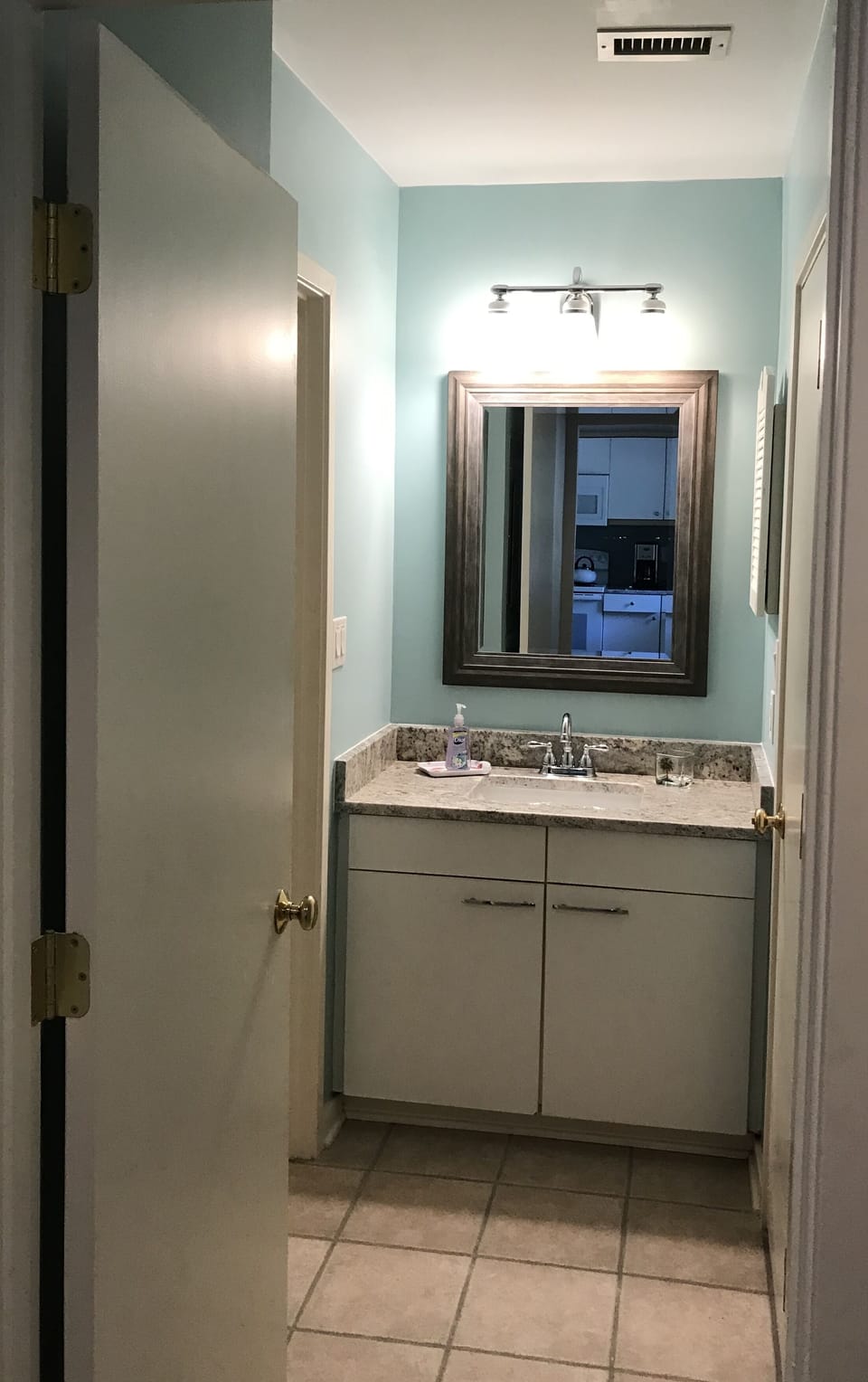 Front bathroom connecting to hallway and front bedroom