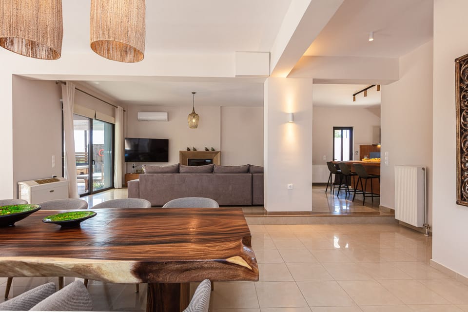 Spacious open-plan living area with natural light and elegant decor.