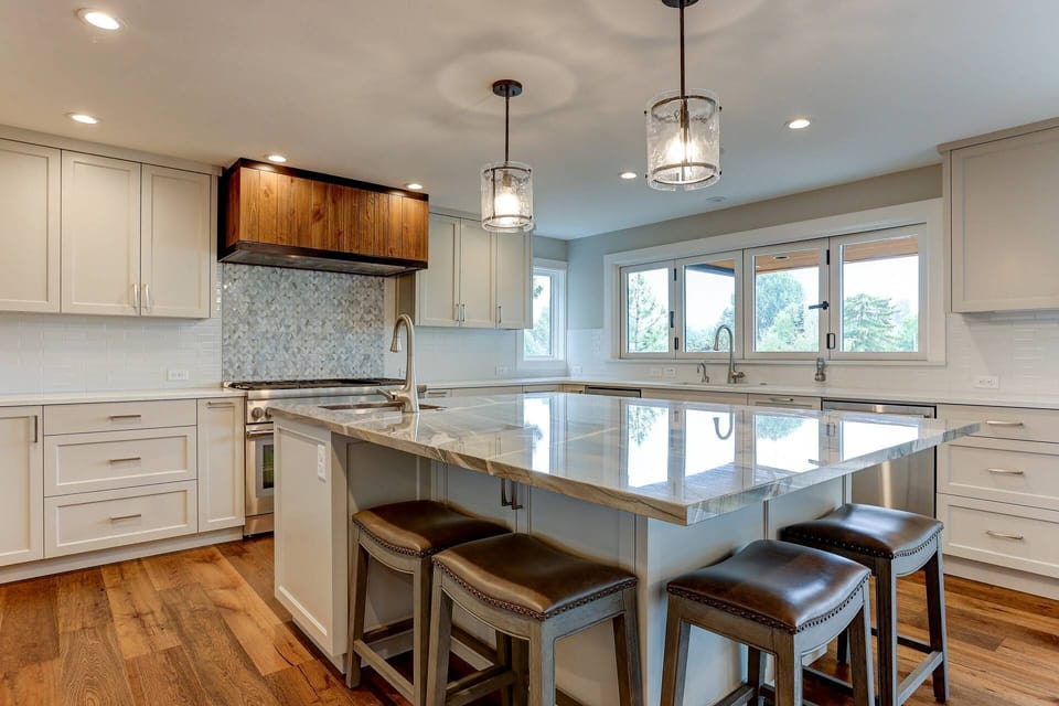 Large entertaining island with seating open to great room.