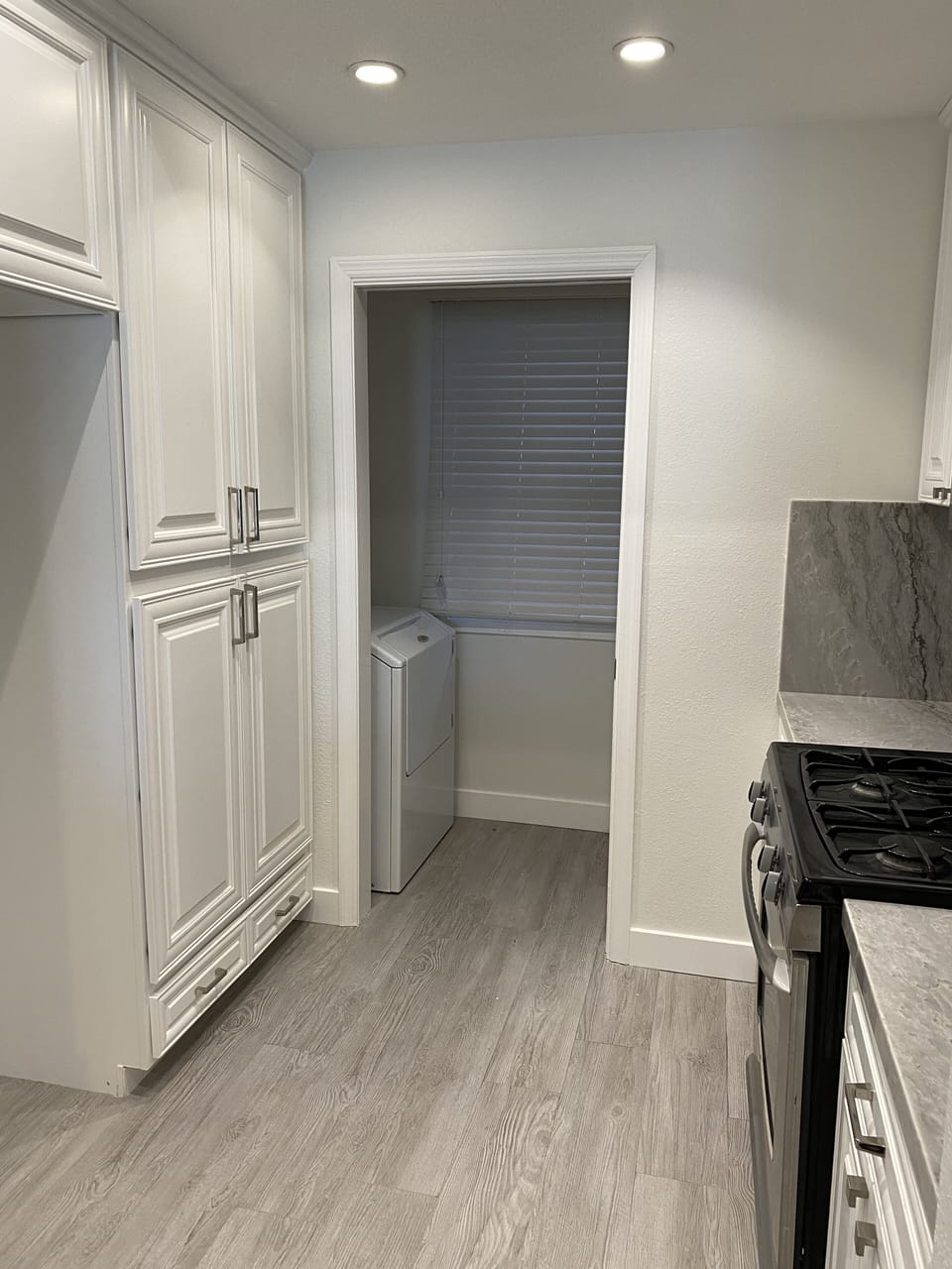 Kitchen with laundry room at the end