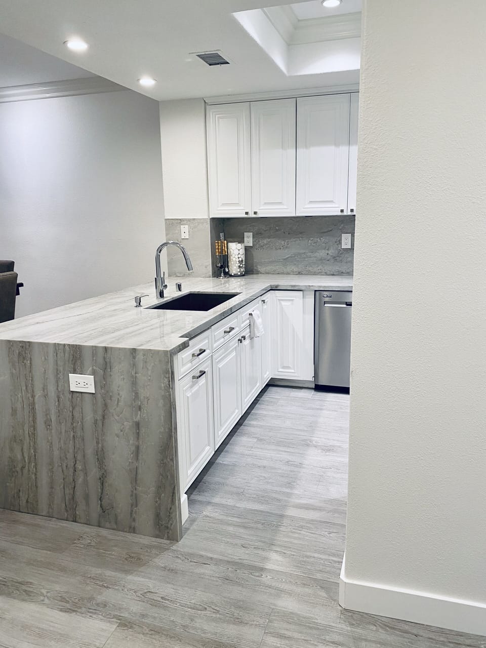 Newly remodeled kitchen with quartzite countertops & new cabinetry