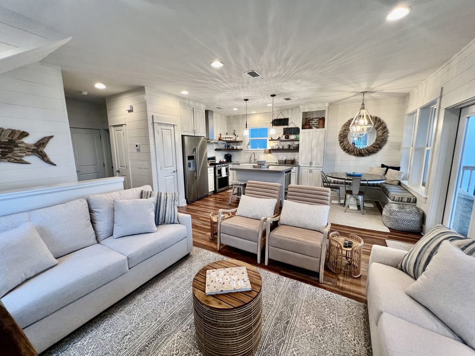 Living space. Two sofas (one queen sleeper) and two recliners. 