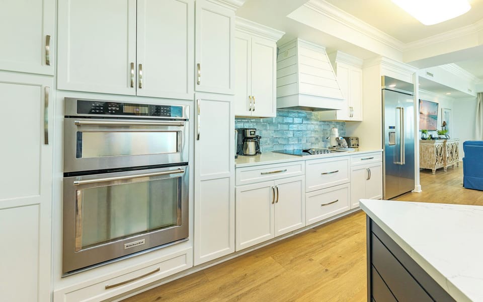 Upgrade your culinary experience in this stylish kitchen with modern stainless appliances and elegant design