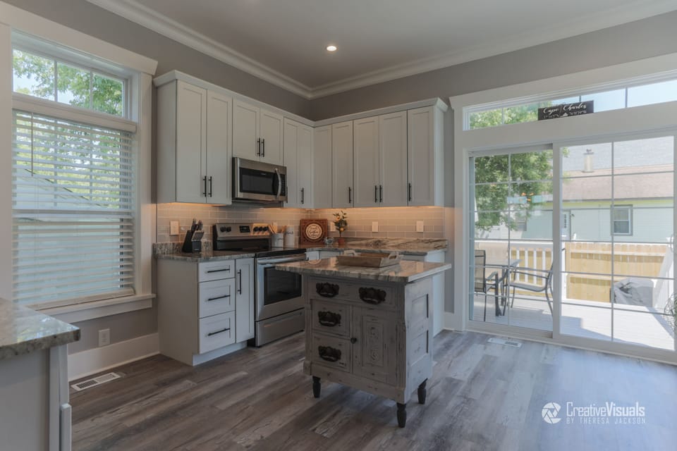 Custom Kitchen w/ ample counter & cabinet space to show off your culinary skills