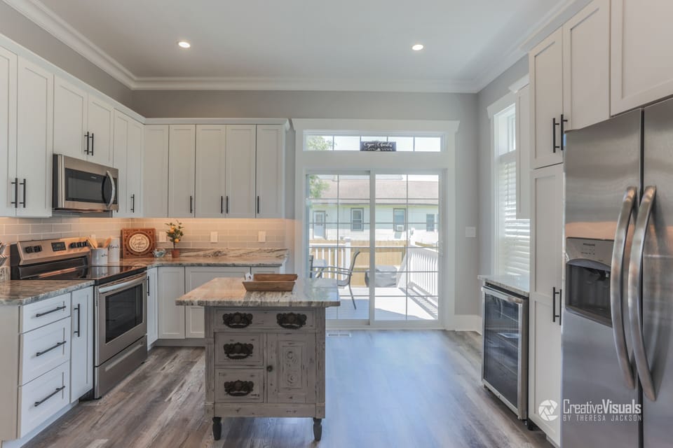 Kitchen w/ all the bells & whistles including a wine fridge & custom island!