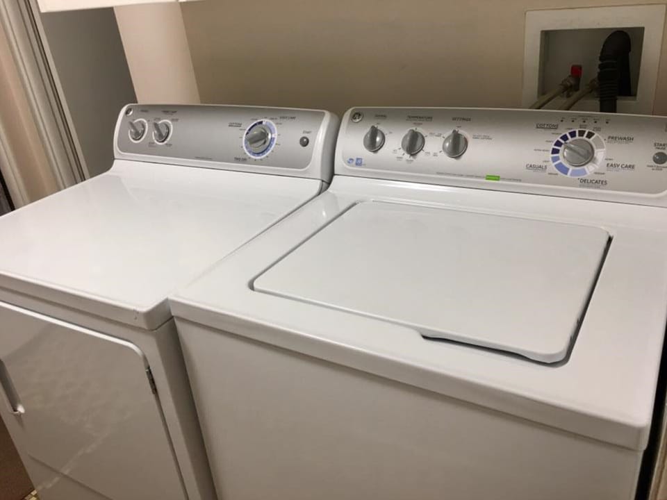 washer and dryer complete with laundry soap and fabric softener