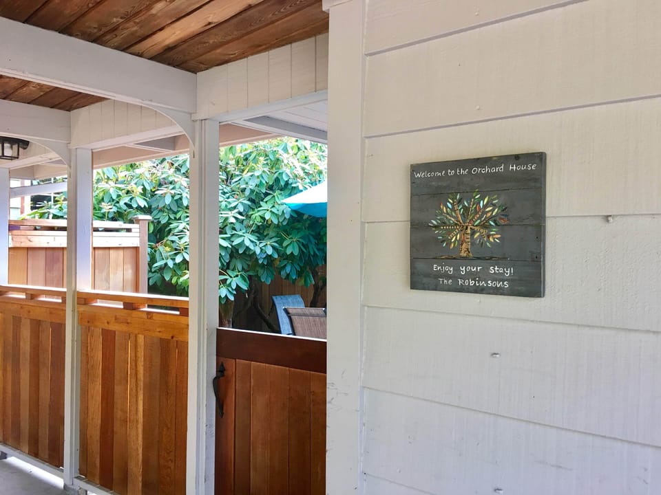 Car port and entrance to the house thru the gate in a patio.