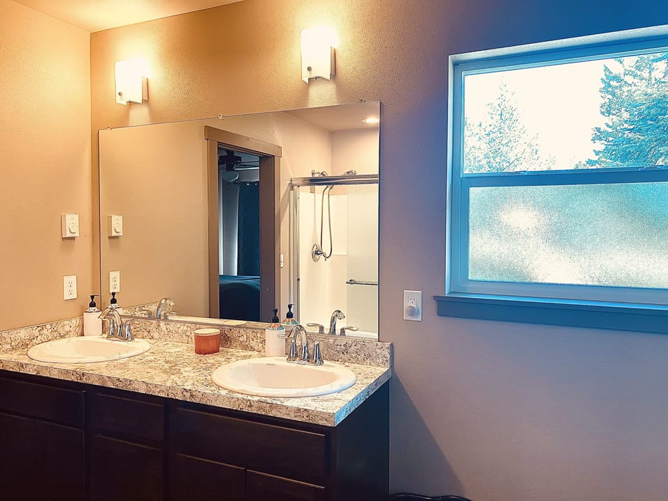 Dual sink, toilet and shower.  Full size washer and dryer in bathroom.