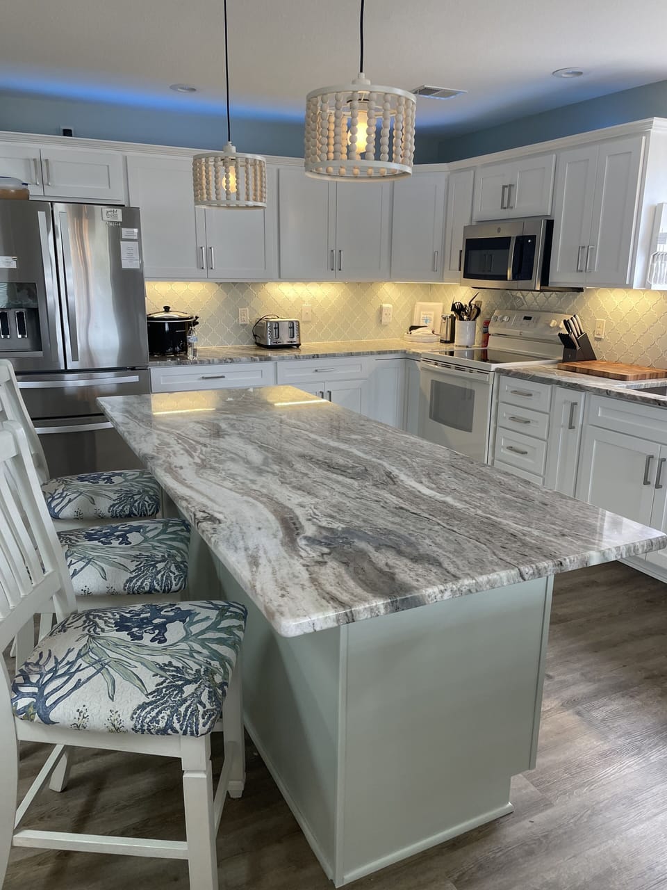 A large kitchen island makes meal prep and serving a breeze.