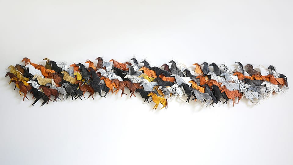 Origami Horses artwork in bonus room between bedrooms