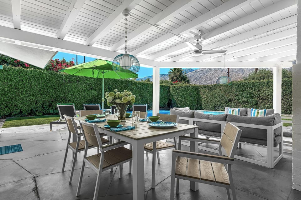 Enjoy al fresco dining in our charming outdoor area, complete with a spacious table perfect for gatherings. Savor meals under the stars, surrounded by lush landscaping, and unwind in the warm ambiance. Ideal for creating unforgettable memories!