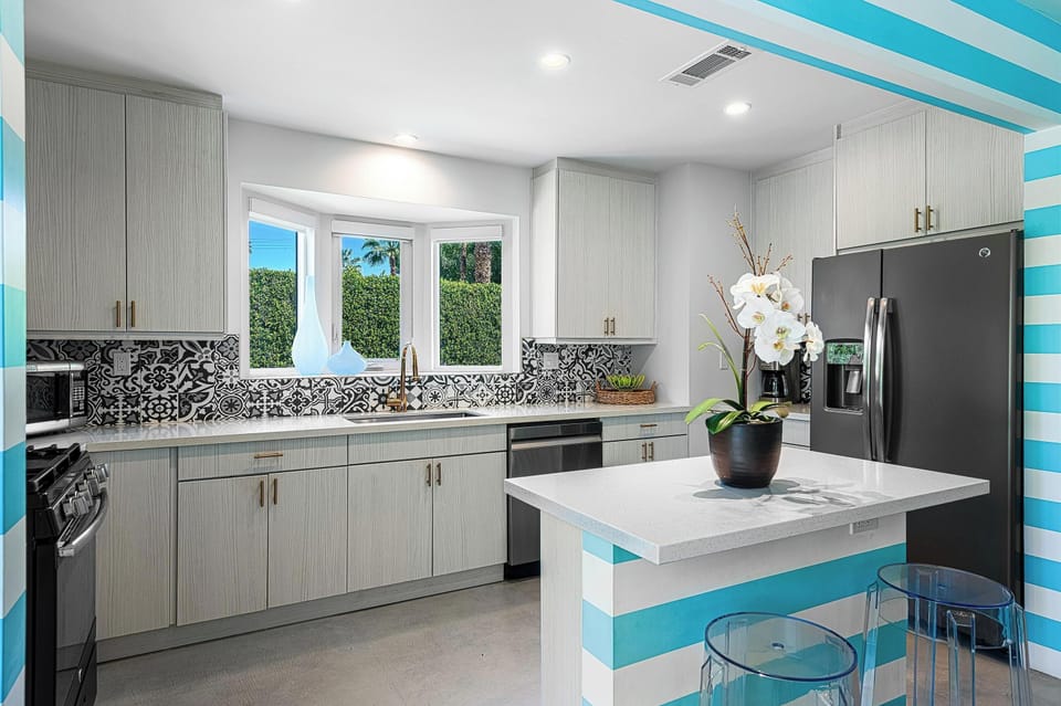 Step into a chef’s paradise in this modern kitchen, where functionality meets style. Equipped with stainless steel appliances, sleek countertops, and ample cabinet space, it invites you to cook and gather with friends and family.