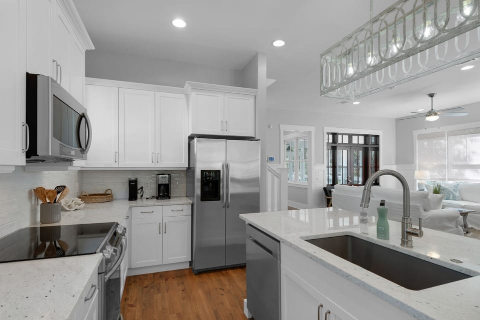 Brand new white kitchen with convection oven, composite sink, fully furnished. 