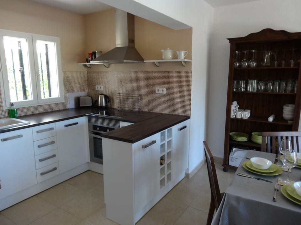 Well equipped kitchen with dishwasher, fridge freezer, microwave, oven, hob.
