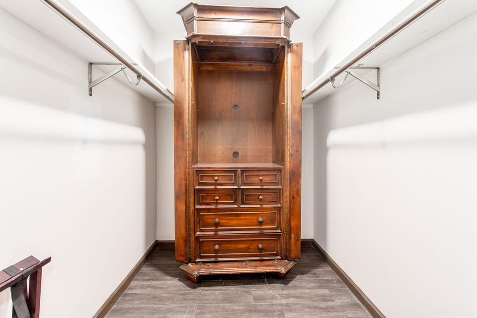 Custom designed storage unit in master bedroom. Bring all the clothes you want.